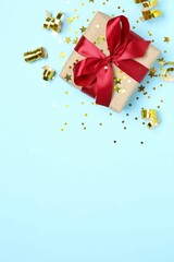 Beautiful gift box tied with bow on color background 