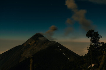 Volcano Fuego erupting at night from view of Volcano Acatenango, Guatemala.