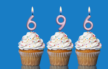 Birthday Cupcakes With Candles Lit Forming The Number 696
