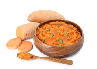 Tasty mashed sweet potato with thyme in bowl, spoon and fresh vegetables isolated on white