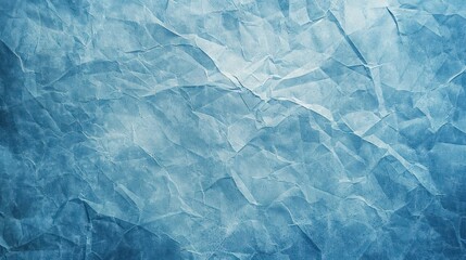 Obraz premium A textured blue background resembling crumpled paper, ideal for graphic design.
