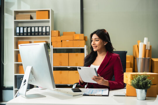 entrepreneur or freelance checking orders from customers, woman runs an e-commerce business on websites and social media.
