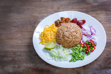 Shrimp paste fried rice or Khao kluk kapi is a delicious Thai dish that combines many ingredients such as shrimp paste, mixed with Thai jasmine rice and various side dishes.