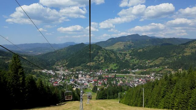 Timelapse of Descending in the Borsa Chairlift Runc-Stiol, with the Majestic Rodnei Mountains as the Backdrop, Bucovina Region, Romania