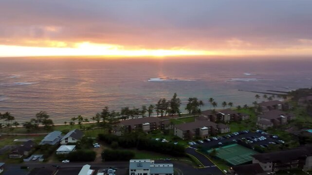 Beautiful view of Kapaa Beach Park, Tropical Hawaiian beach with turquoise blue water in Kauai Hawaii. Kapaa Town During morning golden sunrise, Aerial view.