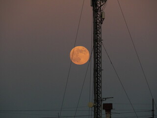 orange moon over the city