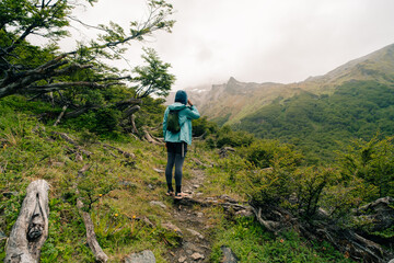 Fototapeta premium hiker looking at the mountains in Patagonia