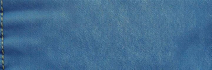 Denim fabric with subtle fading fraying edges and uneven stitching, faded denim, frayed edges