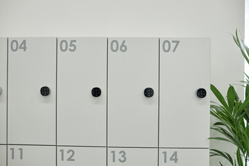 Background shot of metal smart lockers for personal belongings of employees equipped with digital...