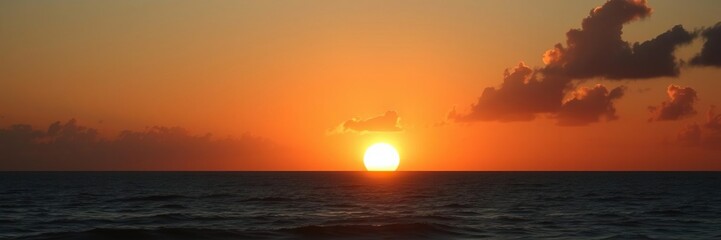 Majestic sun rises above the horizon casting a warm glow over the peaceful ocean, calming atmosphere, natural beauty, warm tones