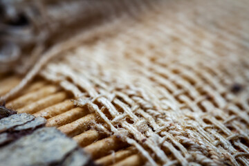Extreme closeup of an old book from the side. Selective soft focus, shallow depth of field. Bibliophile, bookworm abstract background. Book binding detail.