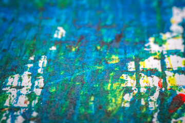 Extreme close up of colorful acrylic paint texture showing brush strokes. Selective focus.