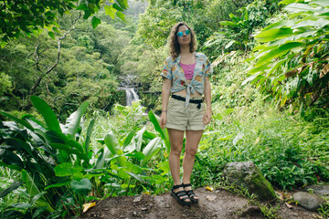girls head with flower I. Hair. Overlooking the views of Hawaii. Lush greenery, overcast skies....