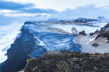 View of Kirkjufjara black sand beach from Dyrholaey promontory on Atlantic South Coast. Iceland, Europe 