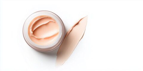 close up of creamy skincare product in jar, showcasing its smooth texture and soft color, ideal for moisturizing and nourishing skin.