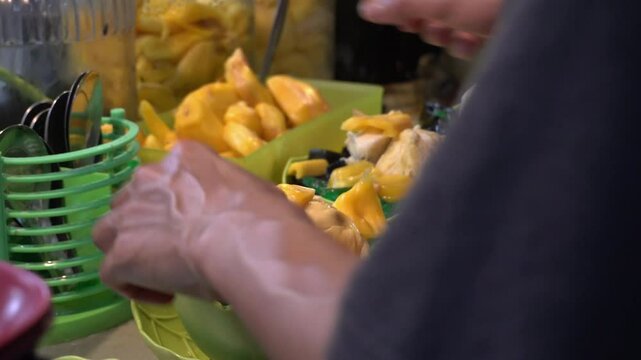 Indonesian Street food. Fresh Ice from tropical fruits making.