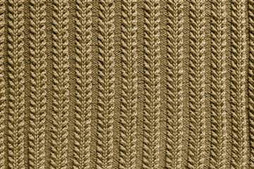 brown background texture knitted fabric. Relief knitting pattern close-up