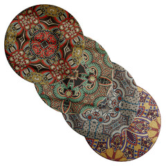 Fototapeta premium Four different colored round plates with intricate designs