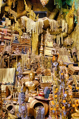 Amazing treasure cave with golden jewelry, treasure chests, pearls, dragons and statues in a Thai...