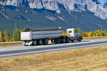 Heavy Cargo on the Road. A truck hauling freight along a highway. Taken in Alberta, Canada