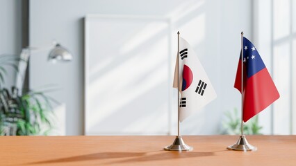 FLAGS OF KOREA SOUTH AND SAMOA ON TABLE