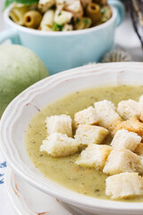 Creamy vegetable soup with croutons.
