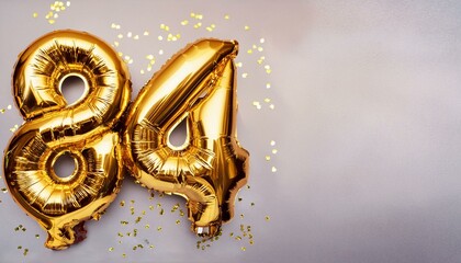 Number 84 golden balloons with copy space 