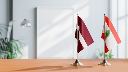 FLAGS OF LATVIA AND LEBANON ON TABLE