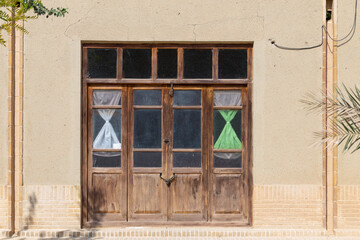 Wooden doors of a village house near Taft, Yazd, Iran. 