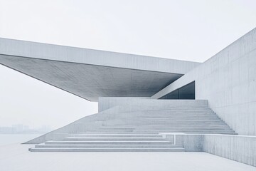 Modern architectural structure with clean lines and expansive steps in a minimalist setting.