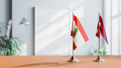 FLAGS OF LEBANON AND NEPAL ON TABLE