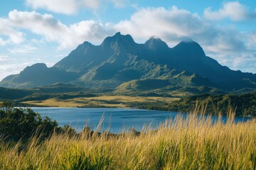 Naklejka premium An amazing island landscape with a lake at the foot of the mountain, shot with a 21mm lens during the day.
