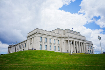 Elegant Building with Lush Green Lawn and Sky