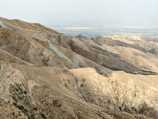 View of landcape with yellow bare mountains and hills. Vivid natural scenery photo.