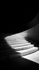 Obraz premium Dramatic black and white staircase with light and shadow patterns