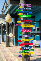 Colorful signs with the word Welcome written in different languages in Wavis Bay, Namibia, Africa