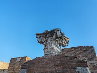 Ostia Antica, Rome, Italy - November 03, 2024, detail of a Roman capital, of the Corinthian order, in the archaeological site of Ostia Antica.