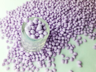 Lavender masterbatch granules on white background,color pigment carrier polymer in plastic...