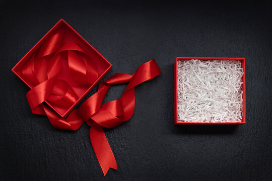 open red gift box with white filler, free space for design, gift for Christmas and Valentine's day concept