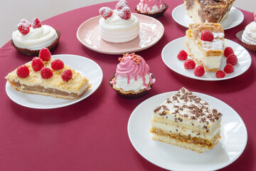 desserts with raspberries on white plates on the table