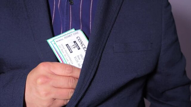 A man is engaged in ticket scalping, selling concert tickets at a significantly higher price than face value,The concept of scalpers