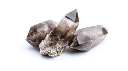 Smoky quartz crystals cluster, showcasing their unique formations and earthy tones against a stark white background.