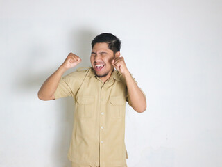 Asian male Indonesian civil servants wearing brown uniforms; usually called keki; look very happy...