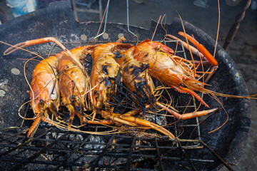 River shrimp grilled on fire with smoke home party