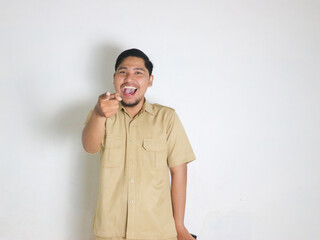 An Asian male Indonesian civil servant wearing a brown uniform who is usually called a keki is...