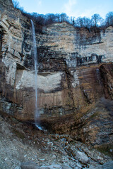 A Majestic Waterfall Cascading Gracefully Over Rocky Cliffs in a Beautiful Scenic Landscape