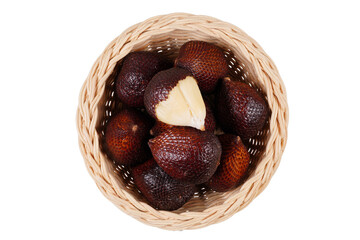 A group of snake fruits on a woven container, some of which have been partially or completely peeled isolated transparent