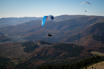 Paragliding in Ciucas mountains, Romania, during autumn season