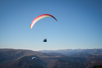 Paragliding in Ciucas mountains, Romania, during autumn season
