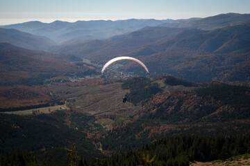Paragliding in Ciucas mountains, Romania, during autumn season